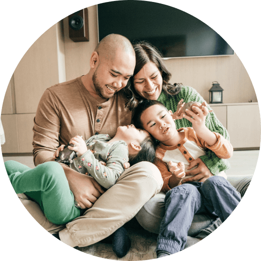 A family playing on the floor of their hotel room