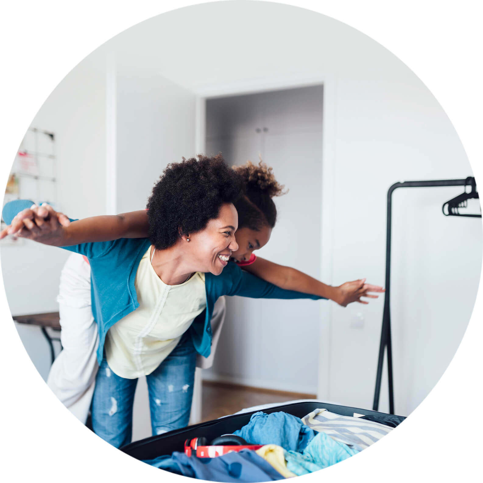  Mother and daughter packing for holidays. 